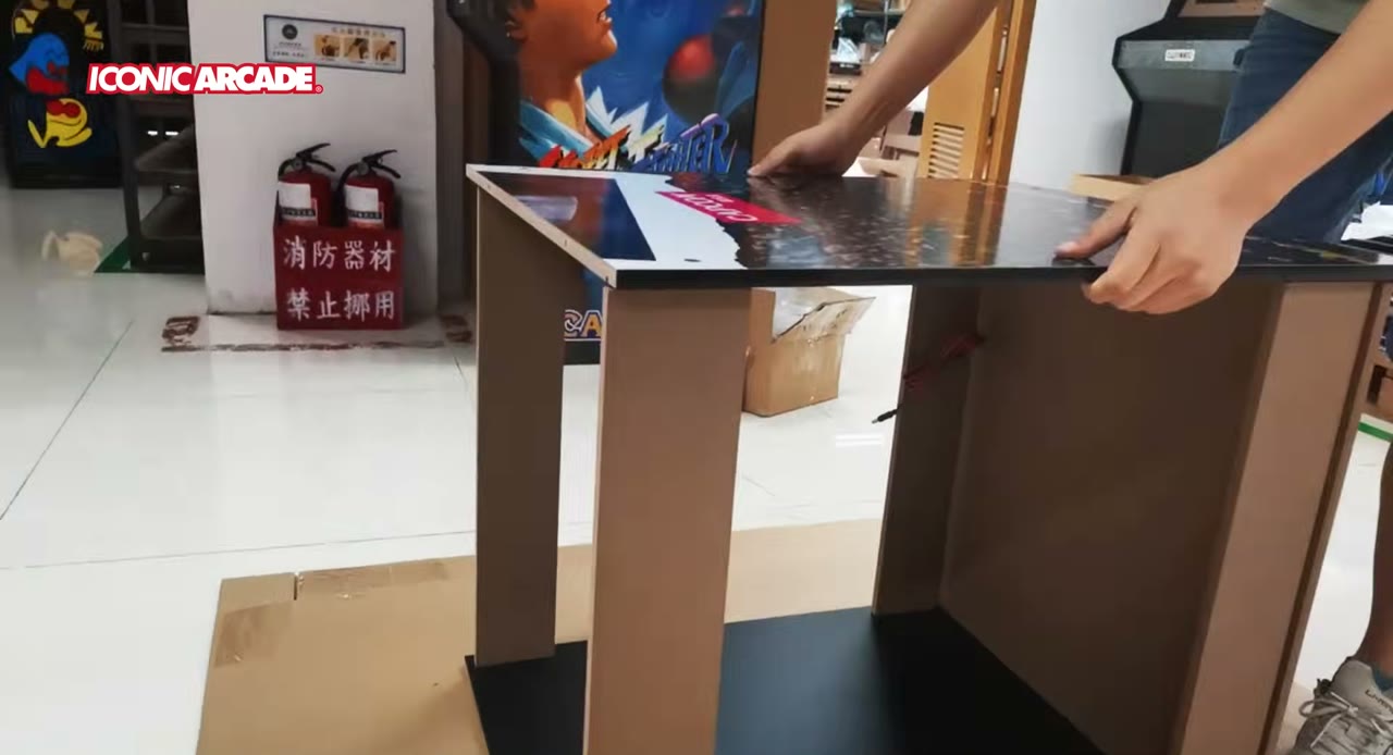 Fitting the Street Fighter II XT control panel top at the factory